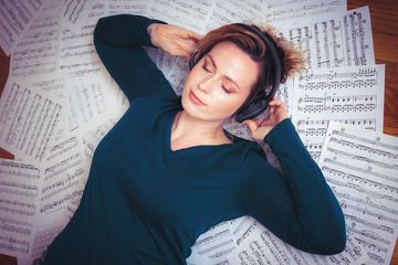 Woman listening to classical music with headphones on