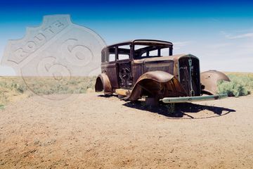 Derelict car on the site of the old Route 66 in the Petrified Forest National Park Arizona USA