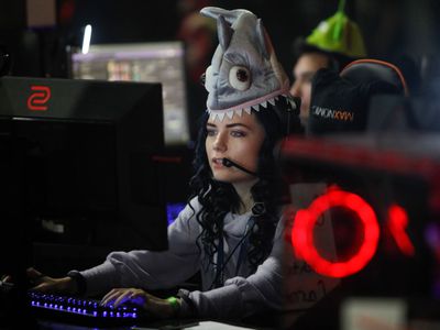 A Twitch streamer playing a game at an esports tournament.