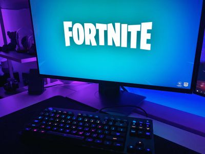 A desktop computer loading Fortnite from the Epic Games Store. 