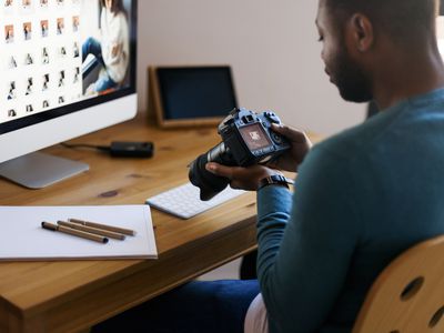 Image of a person searching for a photograph on a computer and on a p hone