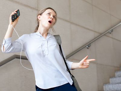 A student listens to Spotify on her phone.