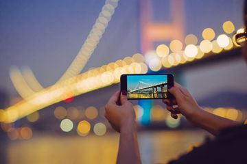 Tourist taking a photo with an iPhone