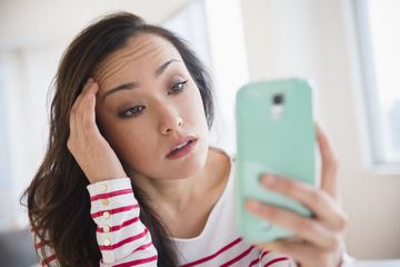 Woman using cell phone.