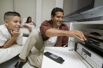 Father and son using a DVD player.