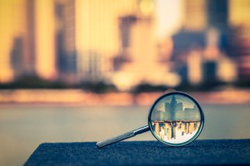 the bund of Shanghai reflected in a magnifying glass