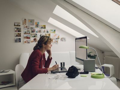 Photographer editing photos on her computer.