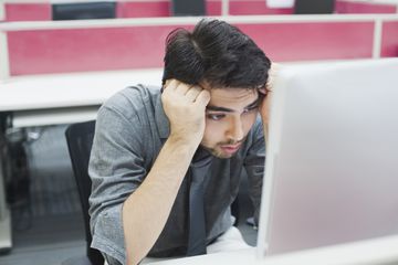 Sad looking person looking at iMac