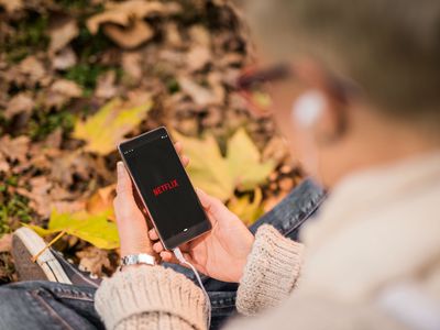 A student accesses Netflix on their phone.