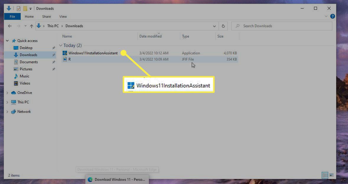 The Installation Assistant executable file highlighted in Windows Explorer.