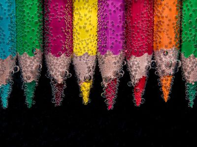 Colored pencils lined up next to each other.