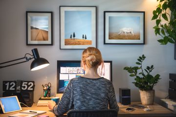 A woman working from home on a computer