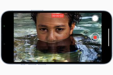 Apple iPhone 13 Pro in video mode recoding a person in water.