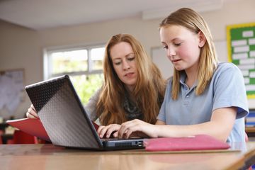 Teacher and Student at a Computer in classroom