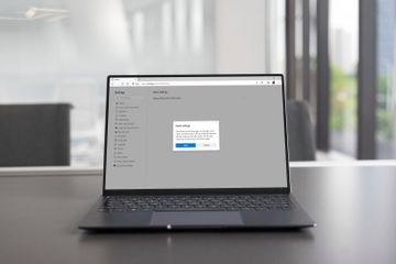 Restoring Microsoft Edge to its original settings on a laptop.