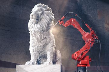 Robotic arm sculpting a lion. 