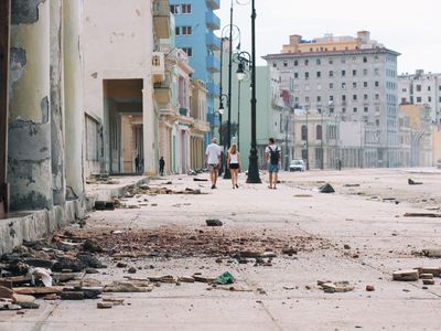 People walking on the street after Hurricane Irma.