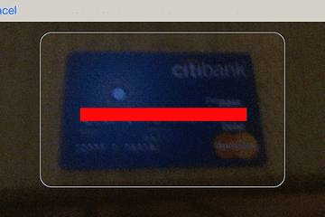 iPhone scanning a credit card in iOS 8