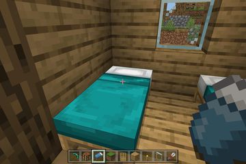 A bed in a house in Minecraft