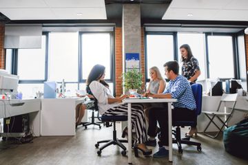 Office team working under Visium lights