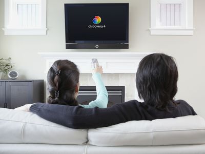 Couple watching Discovery on a TV