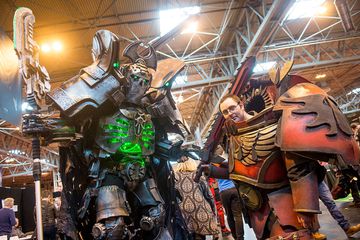 Attendees at Comic Con 2016 in cosplay as their favourite cult characters, A Necron Warrior and a Blood Angel Space Marine from the Games Workshop Warhammer 40K game