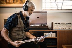 Man Listening to Vintage Stereo Setup