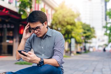 Person looking at a smartphone.