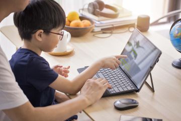 Setting up Windows 11 parental controls with a child.