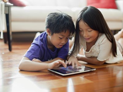 2 Children using tablet