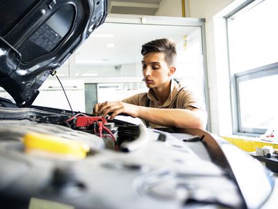 Man working on car battery