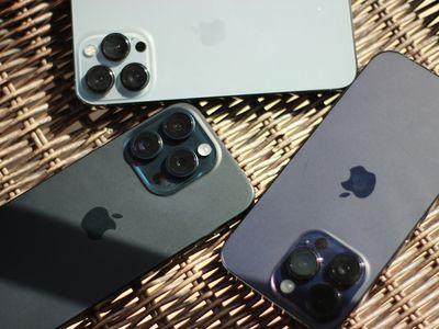 iPhone 15, iPhone 14, and iPhone 13 resting in the sun