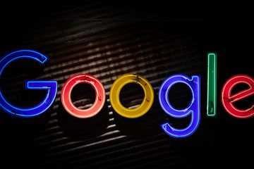 Neon Google logo on dark background