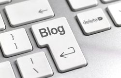 Image of a Keyboard that Reads "Blog"