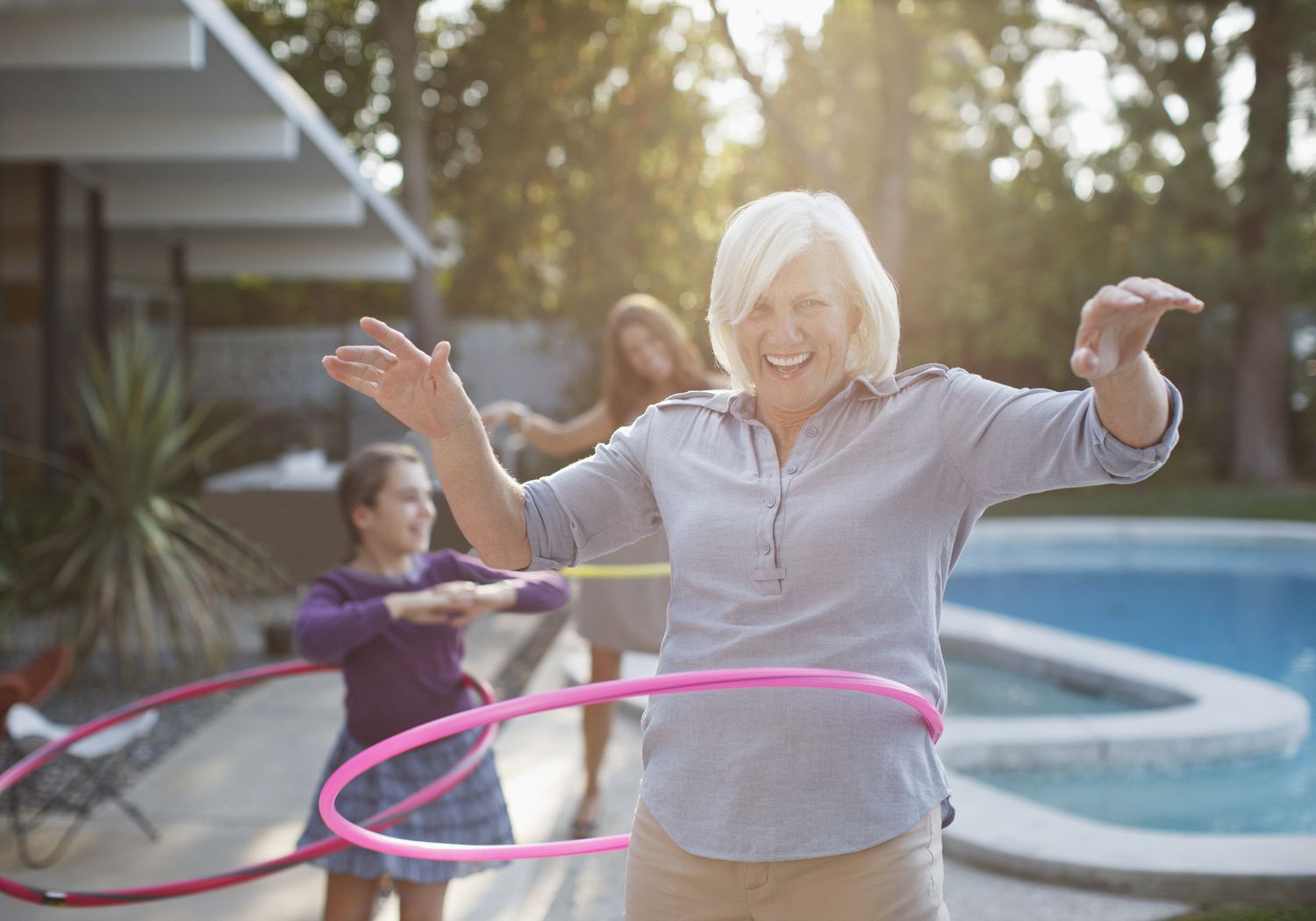 older woman hula-hooping