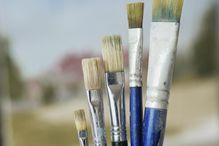 Paintbrushes in increasing height order, close-up