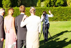 Wedding photographer taking a family photo