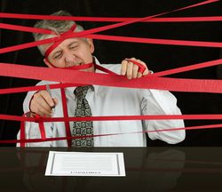 Man fighting through red tape