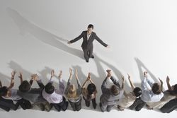 Colleagues applauding businesswoman, elevated view