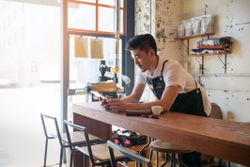 Small business owner working in the cafe