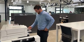 A3-vs-A4-Printers-Copiers-Office-Employee-at-A3-copier