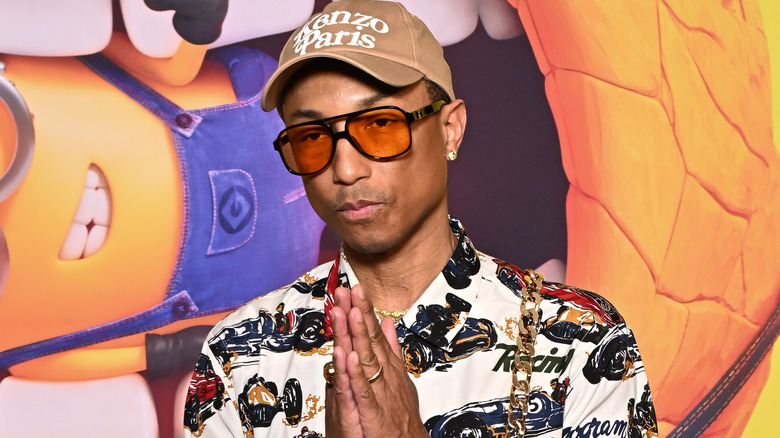 Pharrell Williams with hands together
