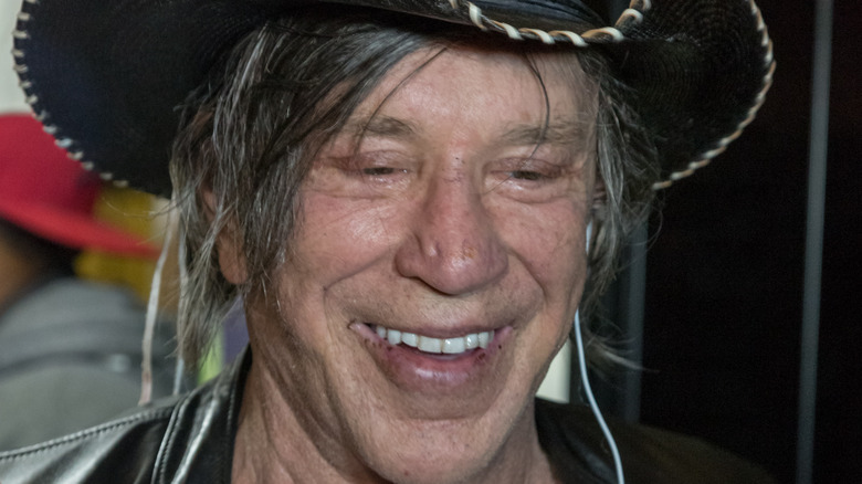 Mickey Rourke laughing in giant hat