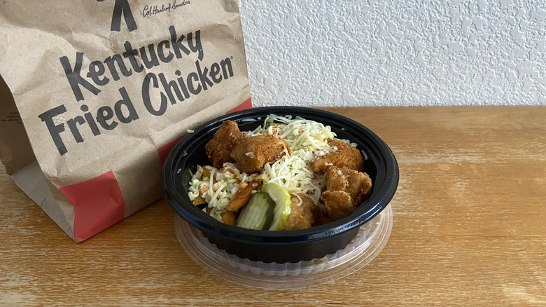 Nashville Hot Loaded Fries Bowl next to KFC bag