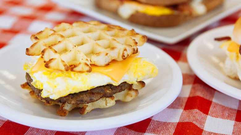 white castle breakfast options on plates with the waffle slider in focus