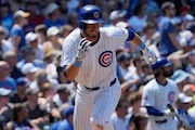 Chicago Cubs' Michael Busch runs after hitting a one-run single during the seventh inning of a baseball game against the St. Louis Cardinals in Chicago, Sunday, June 16, 2024. (AP Photo/Nam Y. Huh)