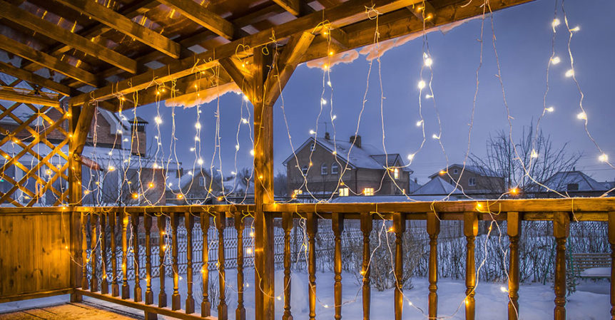 Deck with holiday lights on it.