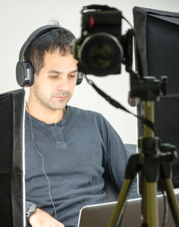 Man with headphones working on laptop