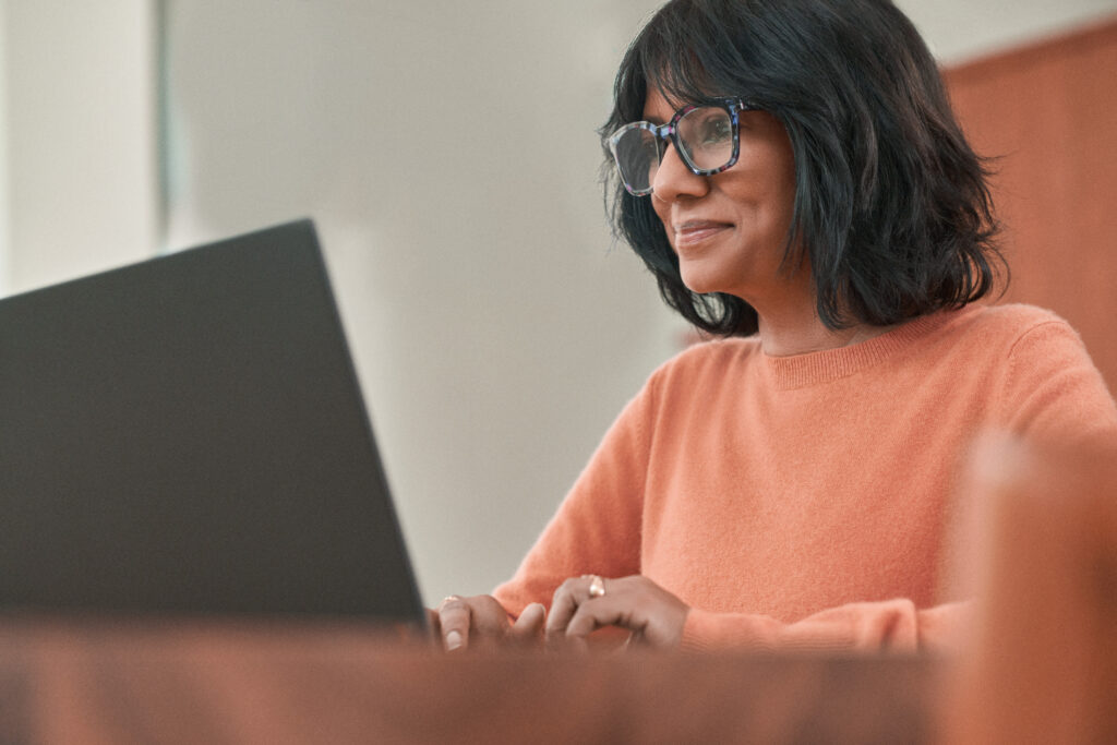 A person working on a laptop.