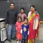 Color image of students in a Malayalam class (level 1) pose for a photograph at the School of India for Languages and Culture (SILC) on Social Studies Day, ca. 2015, in St. Paul. 